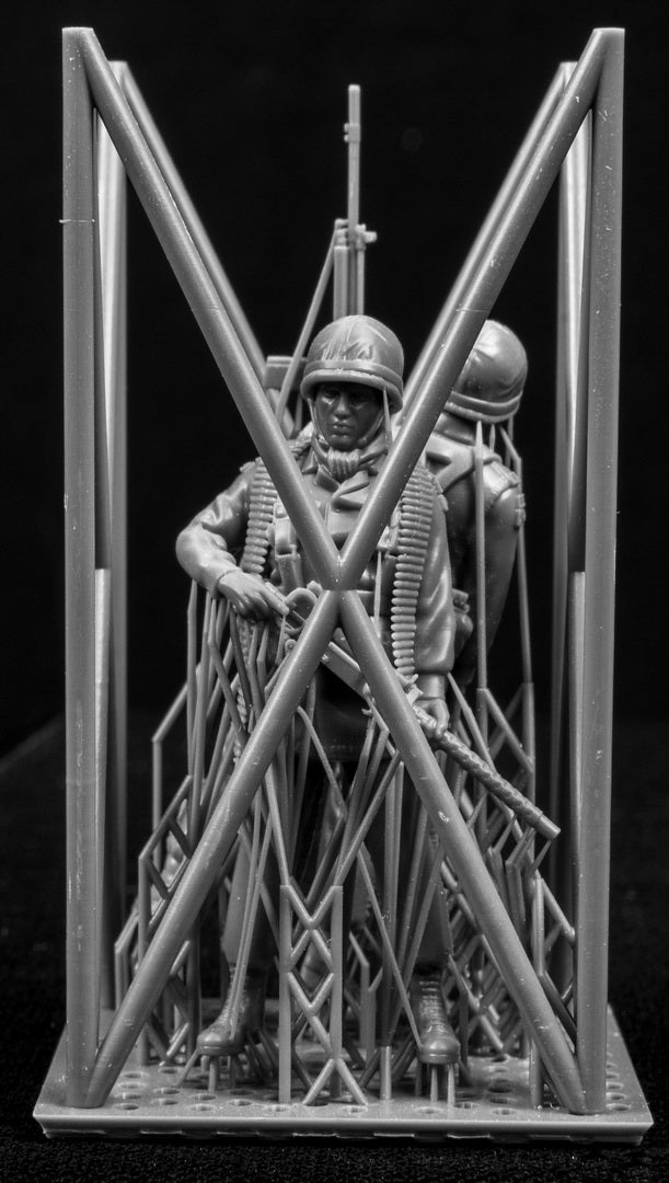 Two 3D Printed figures on a frame set on a black background.