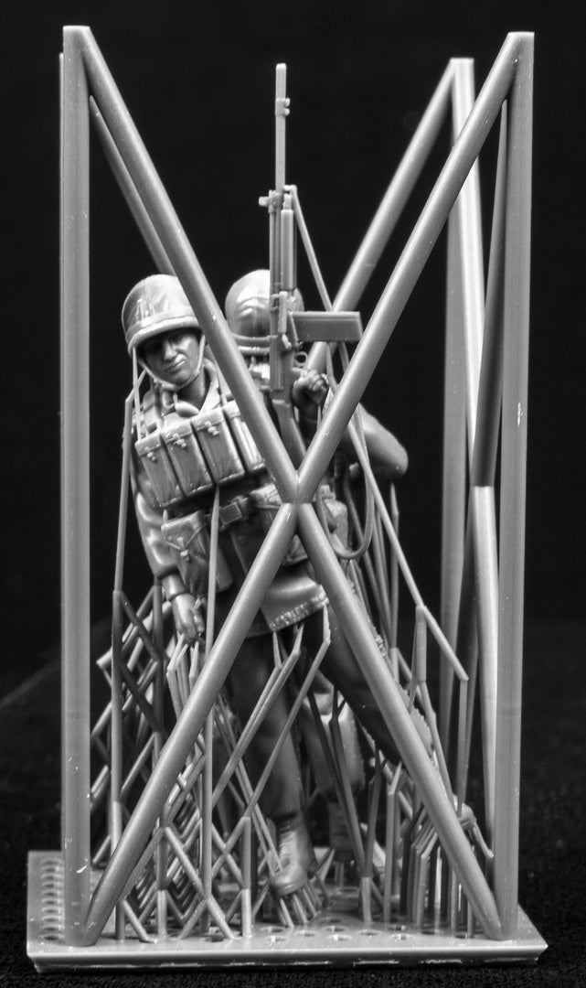 Two 3D Printed figures on a frame set on a black background.