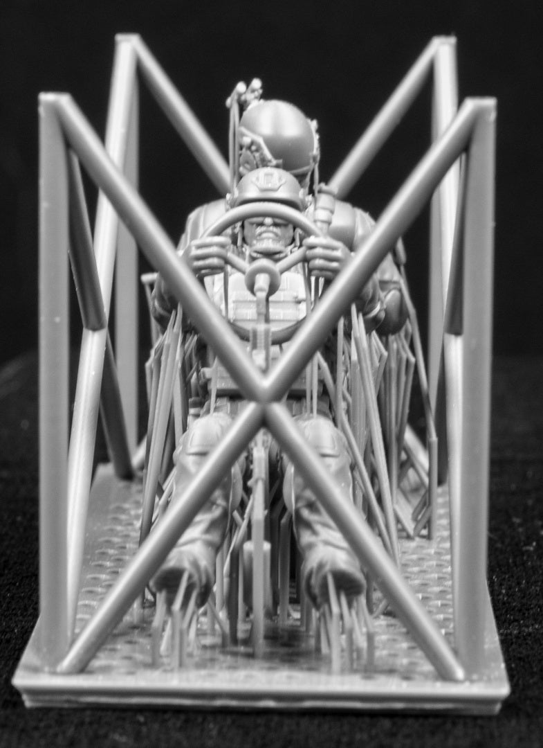 Two 3D Printed figures on a frame set on a black background.