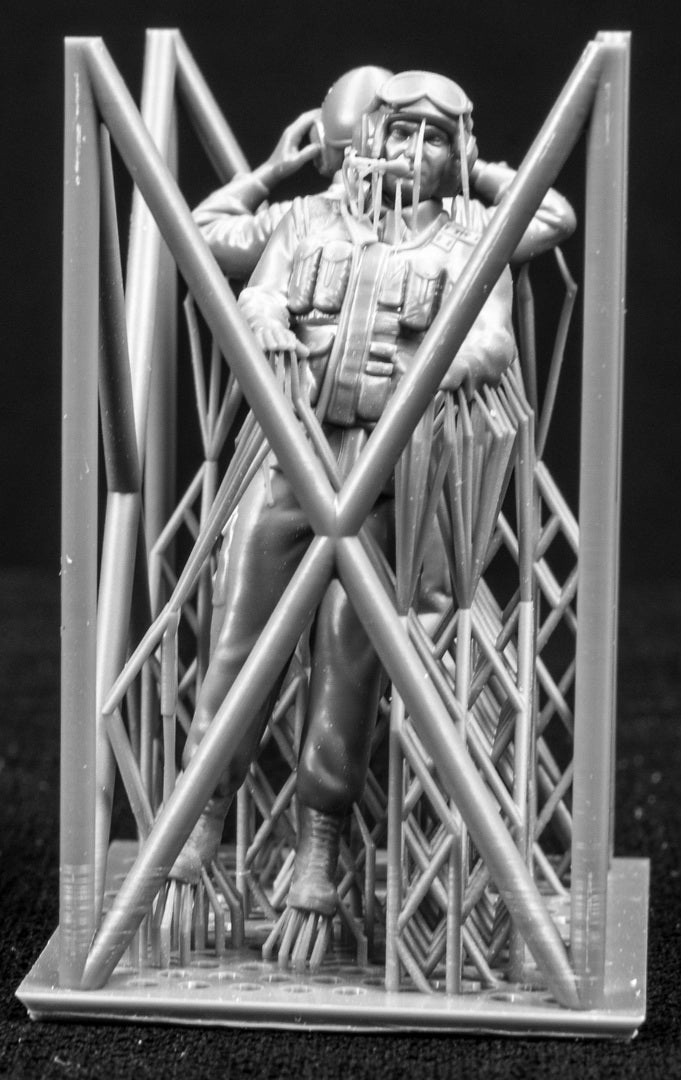 Two 3D Printed figures on a frame set on a black background.