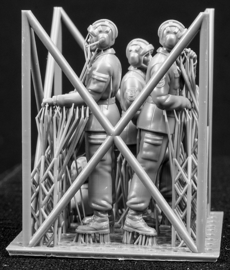 A set of 1/35 Chinese PLA AFV Crew 3D printed figures on a frame with a black background.