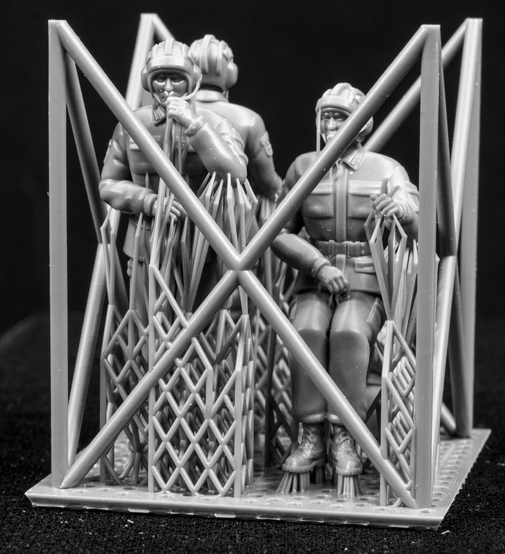 A set of 1/35 Chinese PLA AFV Crew 3D printed figures on a frame with a black background.