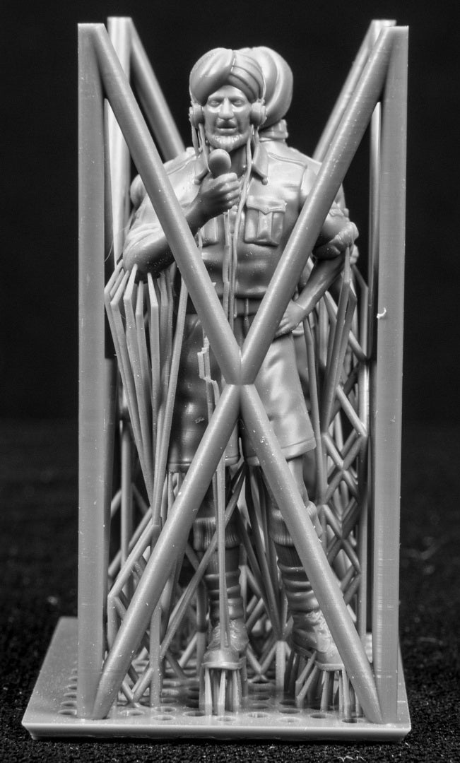 Two figures in a cage on a black background