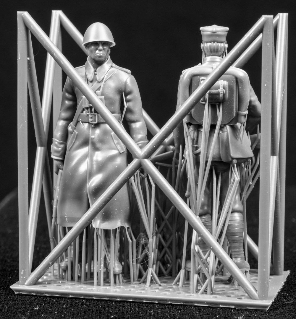 Two figures in a cage on a black background