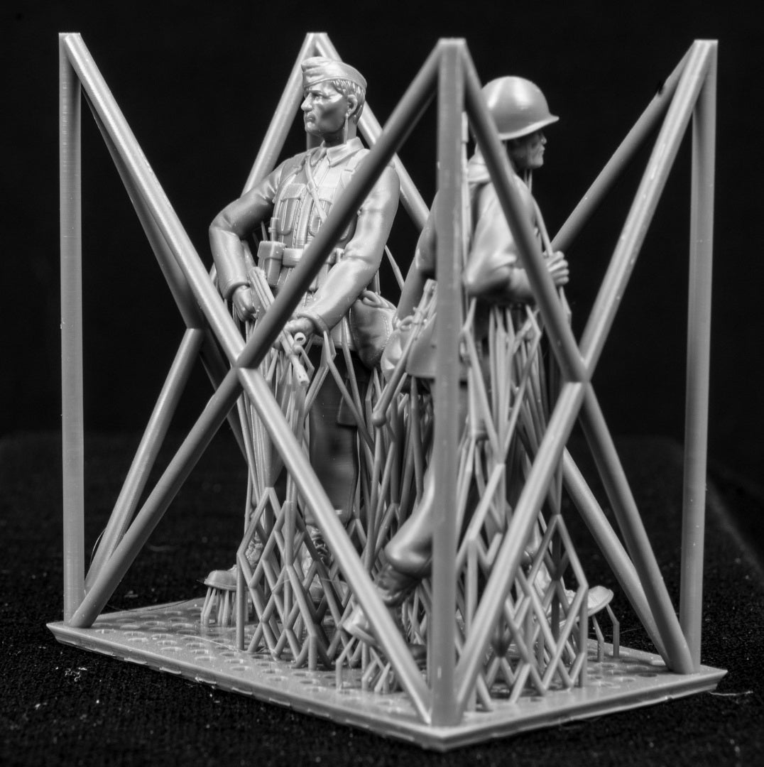 Two figures in a cage on a black background