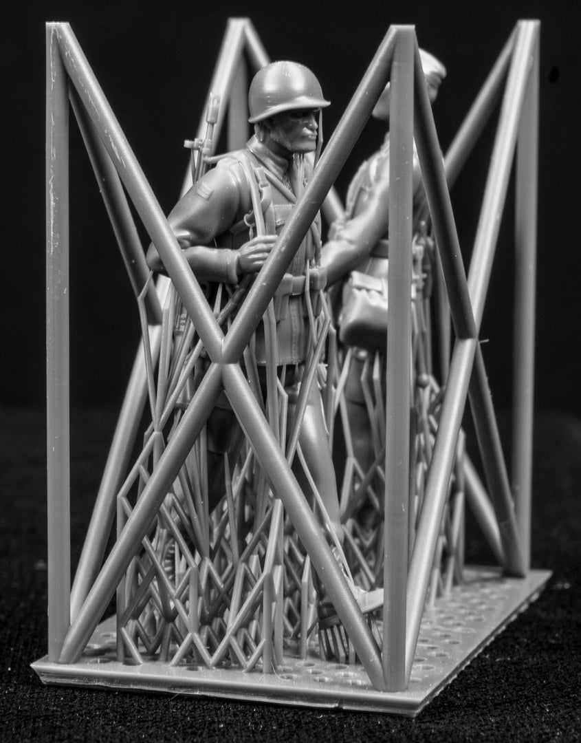 Two figures in a cage on a black background