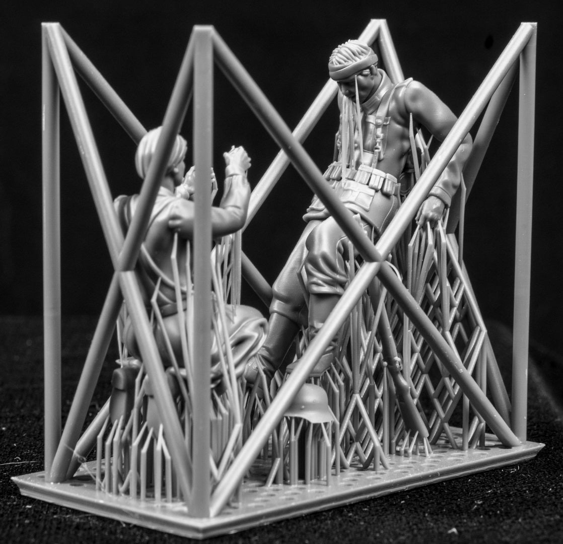 Two 3D Printed figures on a frame set on a black background.