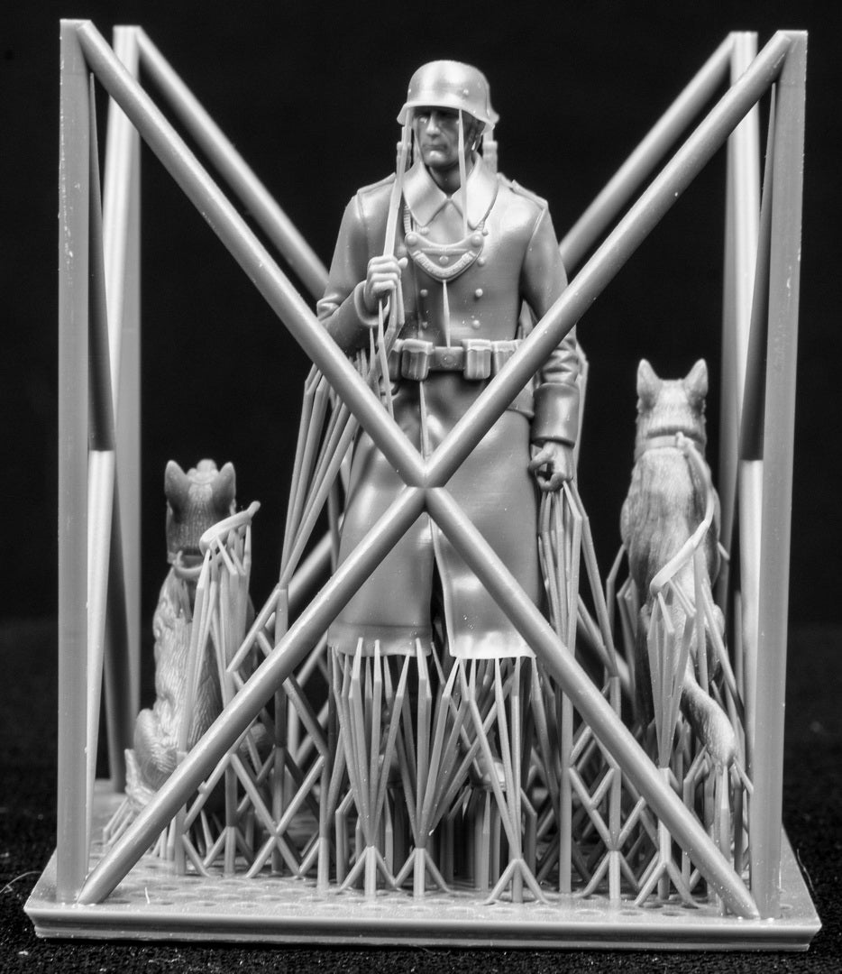 Two 3D Printed figures on a frame set on a black background.
