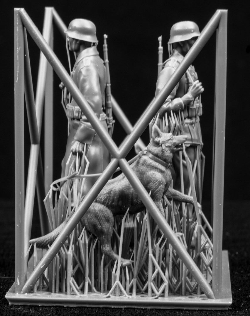 Two 3D Printed figures on a frame set on a black background.
