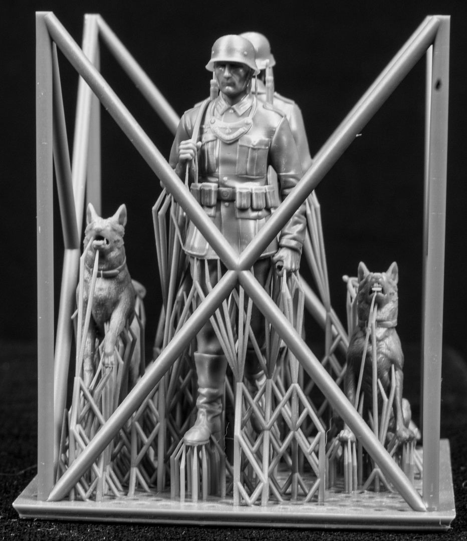Two 3D Printed figures on a frame set on a black background.