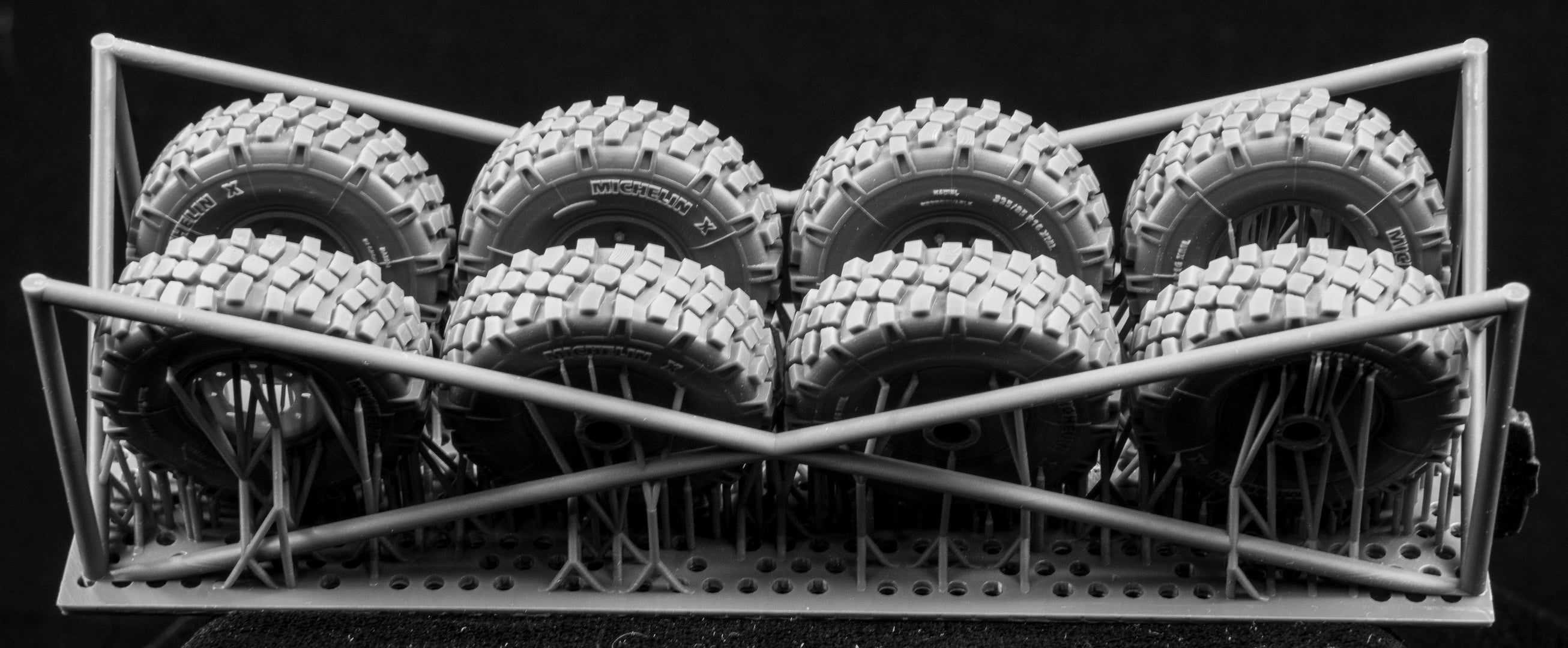  Canadian AVGP Weighted Wheel Set (Late Pattern). Six Tires, two spares on 3D printed frame on black background.
