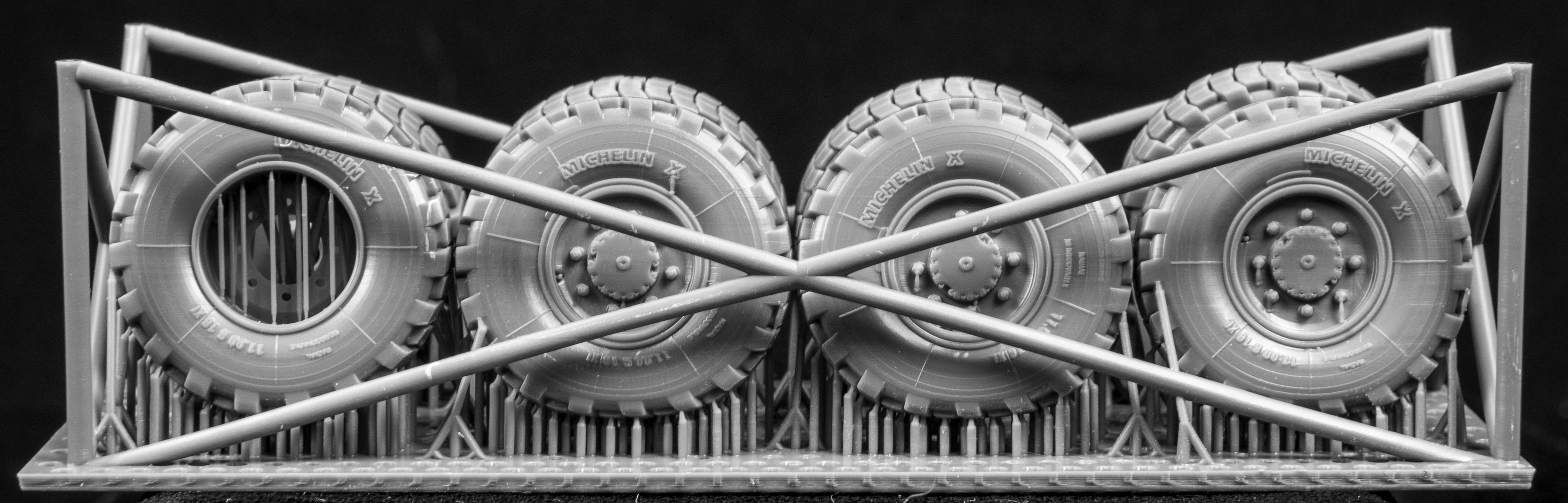  Canadian AVGP Weighted Wheel Set (Late Pattern). Six Tires, two spares on 3D printed frame on black background.