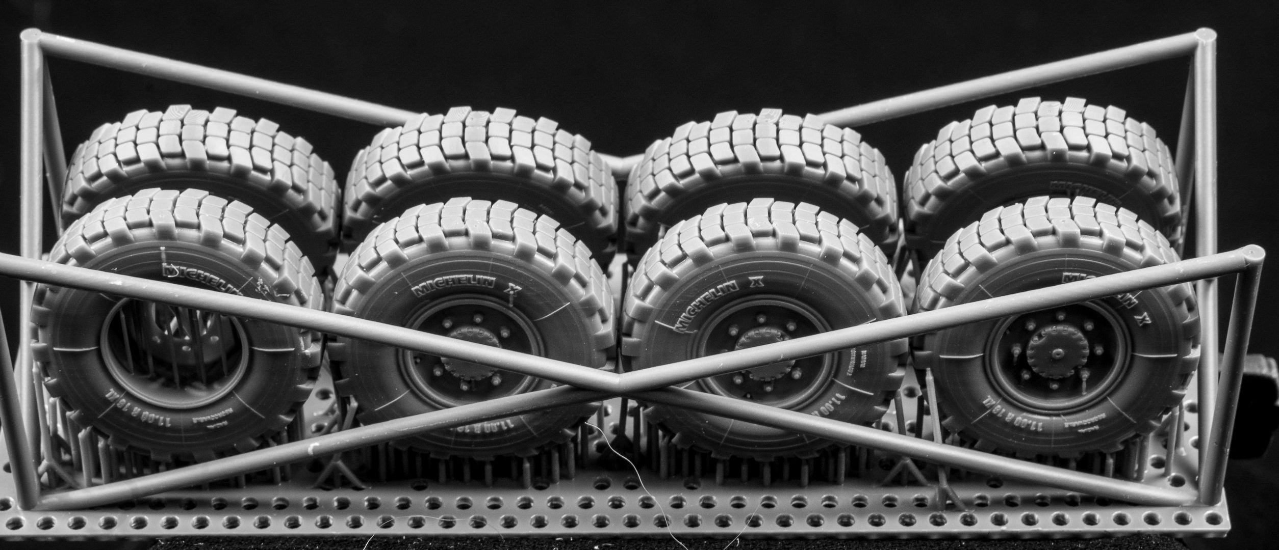  Canadian AVGP Weighted Wheel Set (Early Pattern). Six Tires, two spares on 3D printed frame on black background.