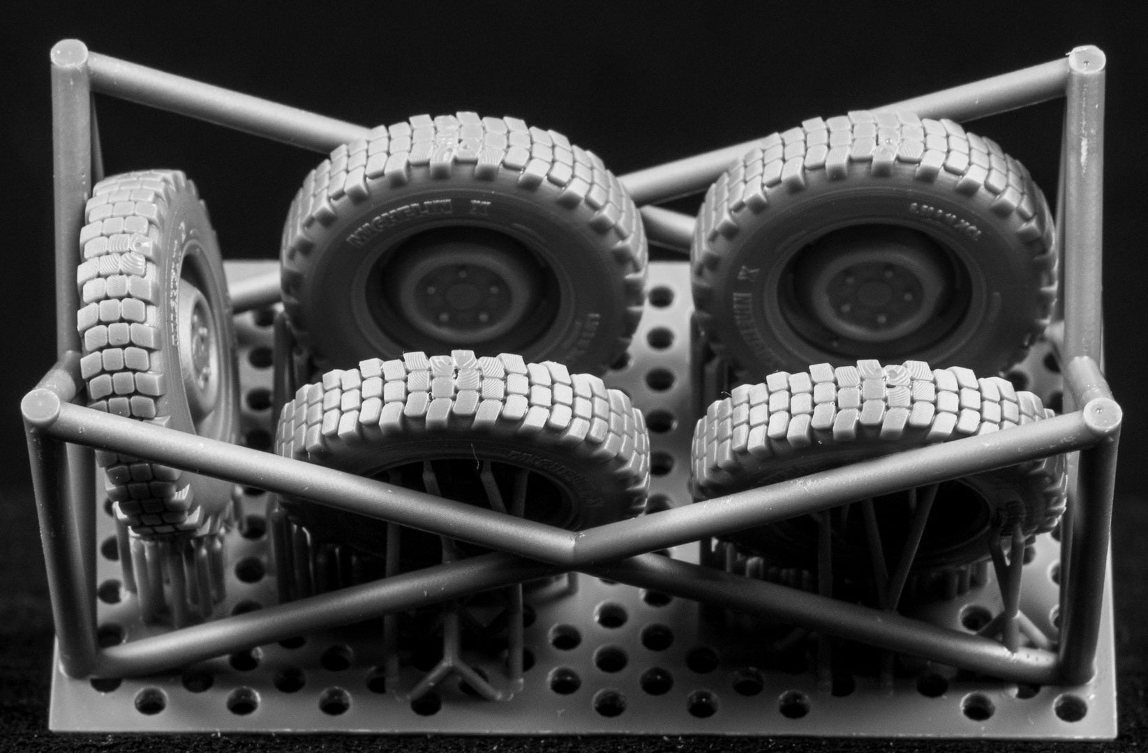 Model of Iltis tires on a frame with  a black background