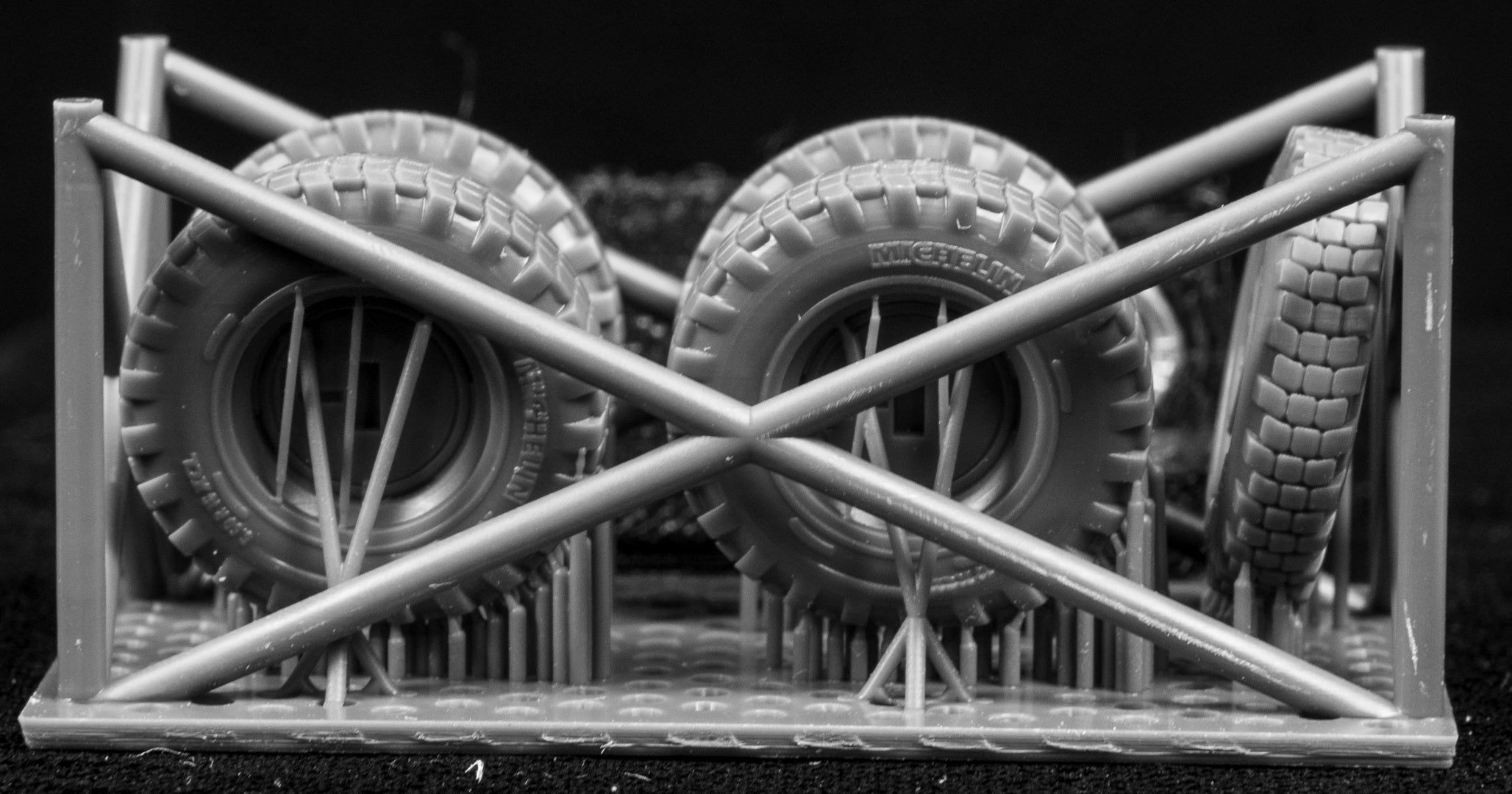 Model of Iltis tires on a frame with  a black background