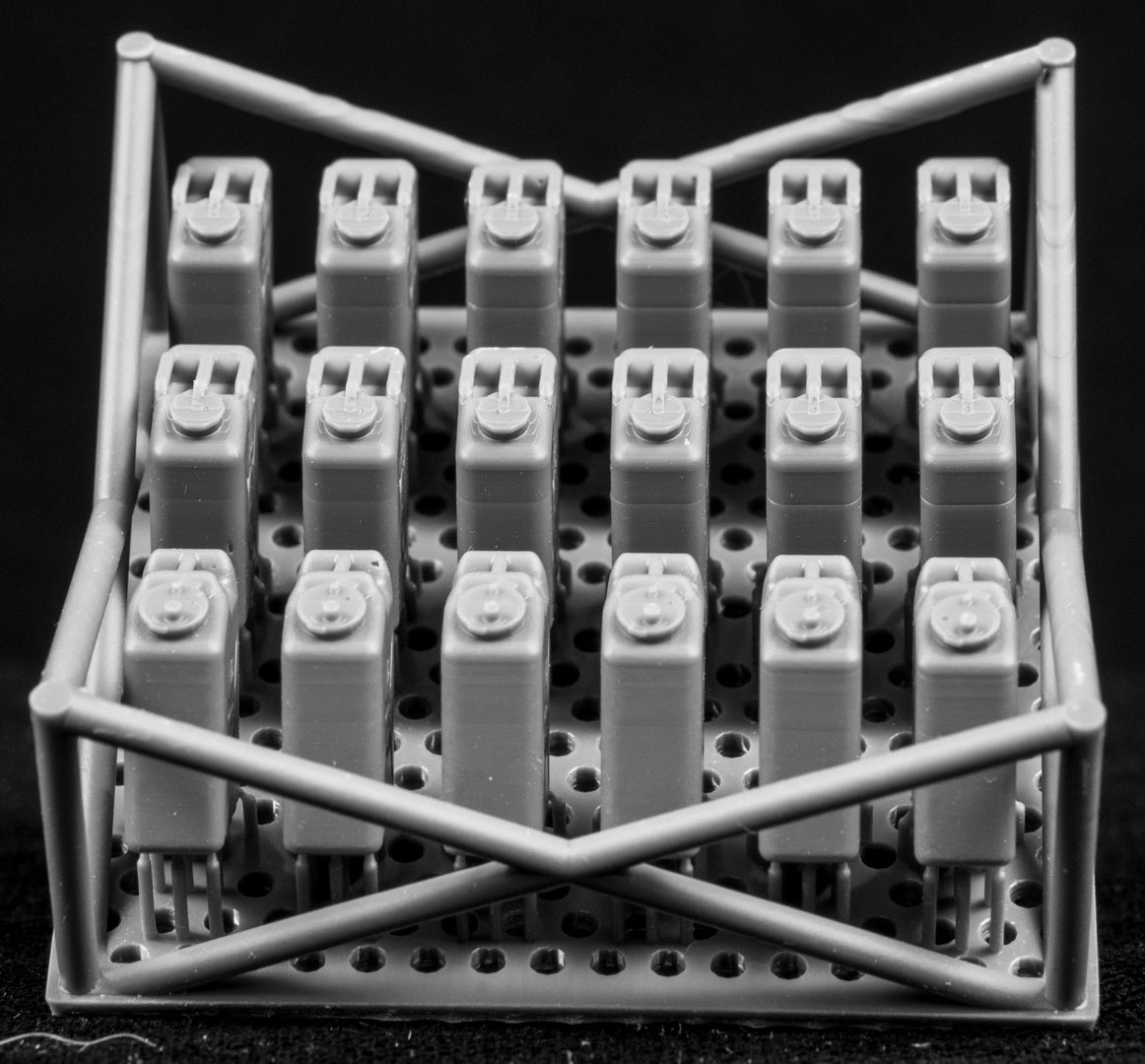 20L fuel containers in a cage-like structure on a black background