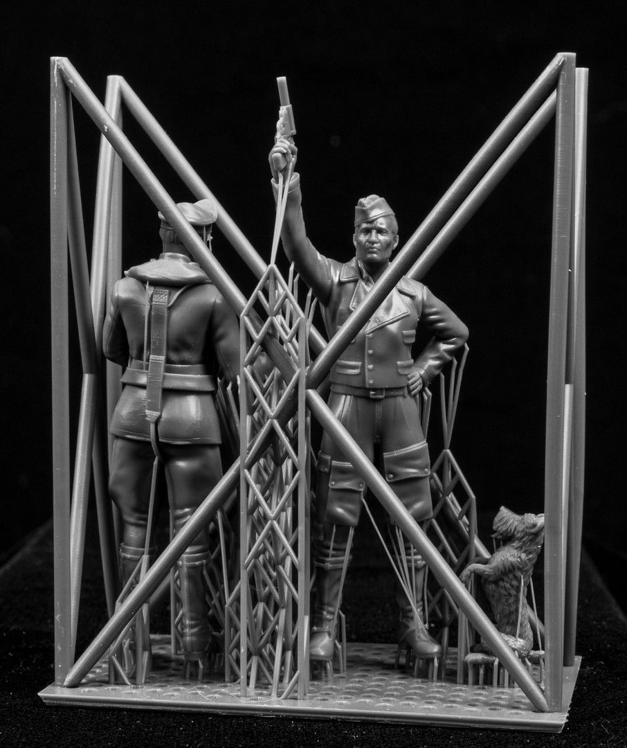 Model figures in a staged scene with a black background