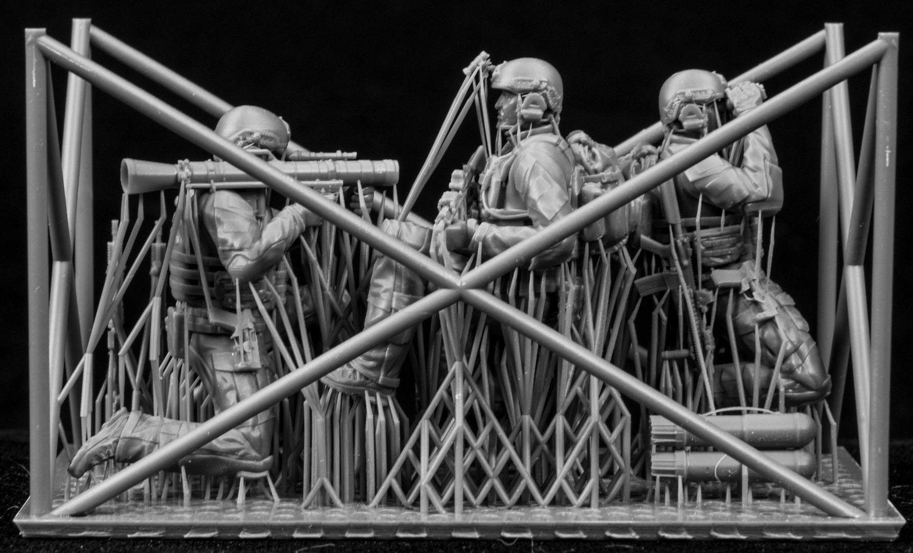 Model of soldiers with equipment on a black background