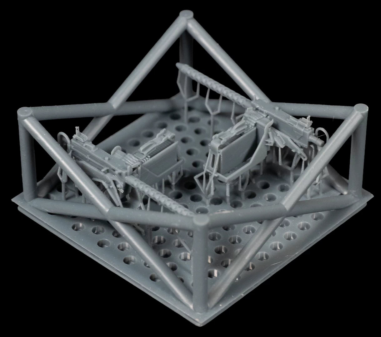 Gray geometric 3D-printed object with small models inside on a black background